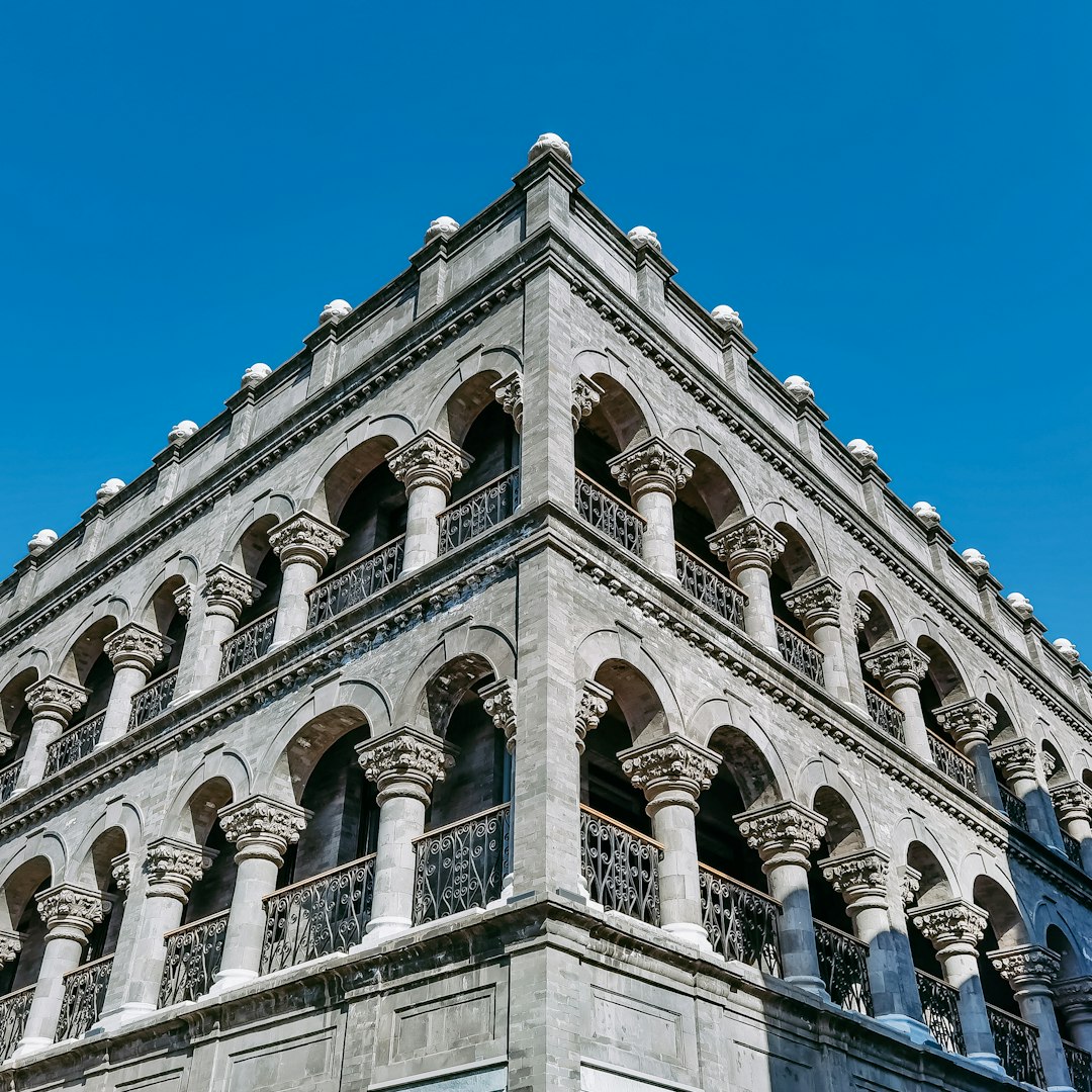 white concrete building under blue sky during daytime