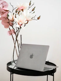 macbook air on black and white table