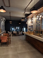 Interior of a cozy café captured in a 360-degree photo, highlighting warm lighting and inviting atmosphere.