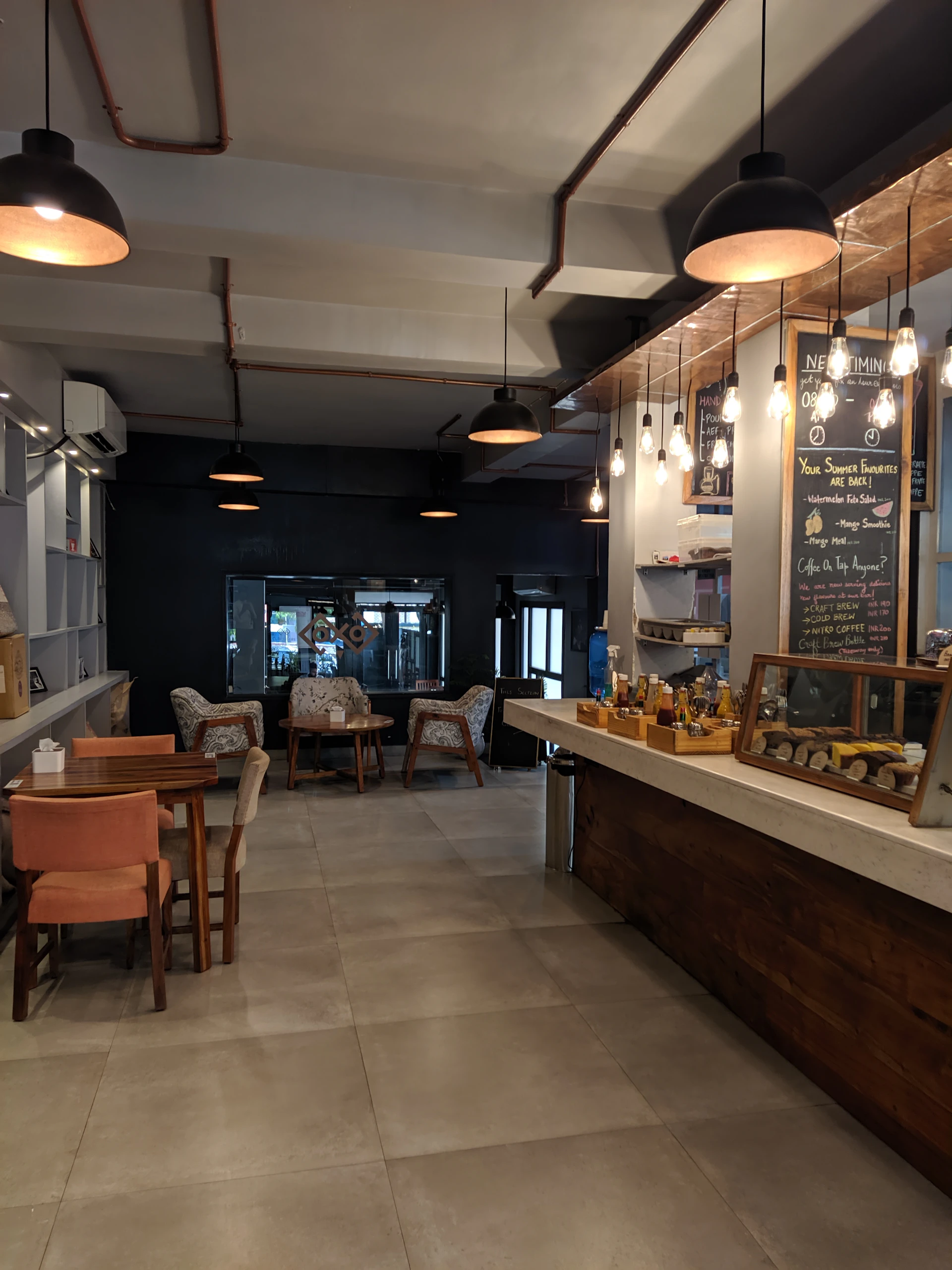 A vibrant photo capturing the cozy interior of a local café inside the plaza, with warm lighting and inviting seating.