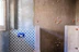 Close-up of freshly repaired bathroom tiles with a smooth finish.