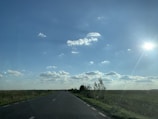 An open road leading towards a bright horizon, representing freedom.