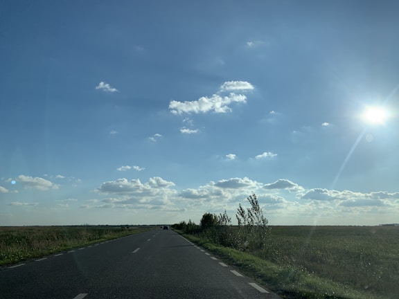 An open road leading towards a bright horizon, representing freedom.