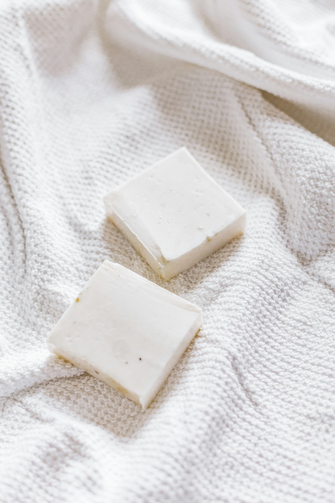 white square soap on white textile