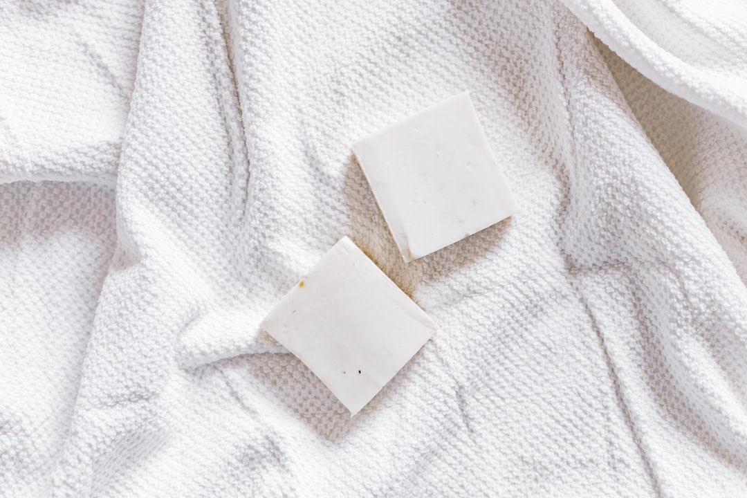 white square paper on white textile