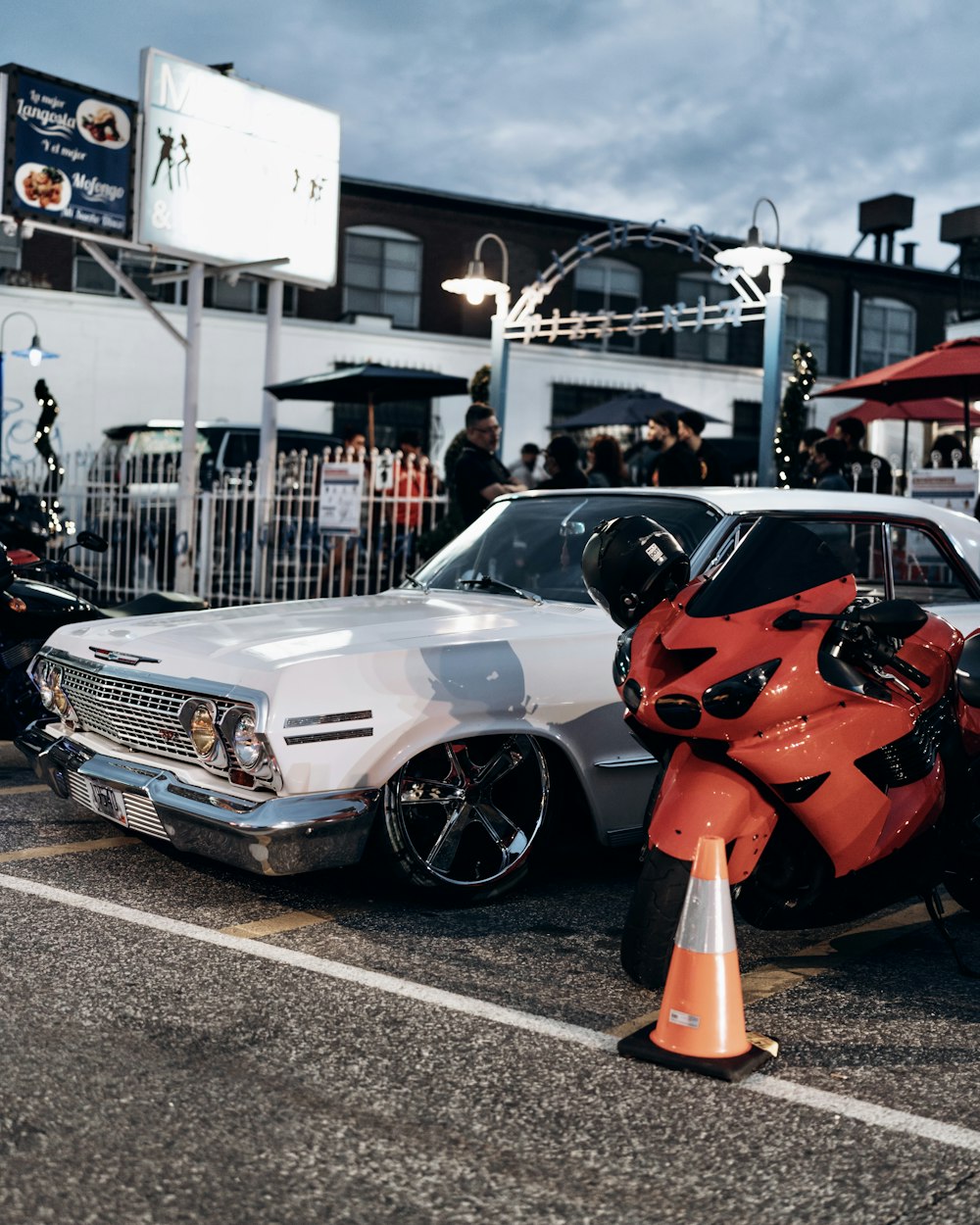 white and orange bmw m 3 parked on parking lot during daytime