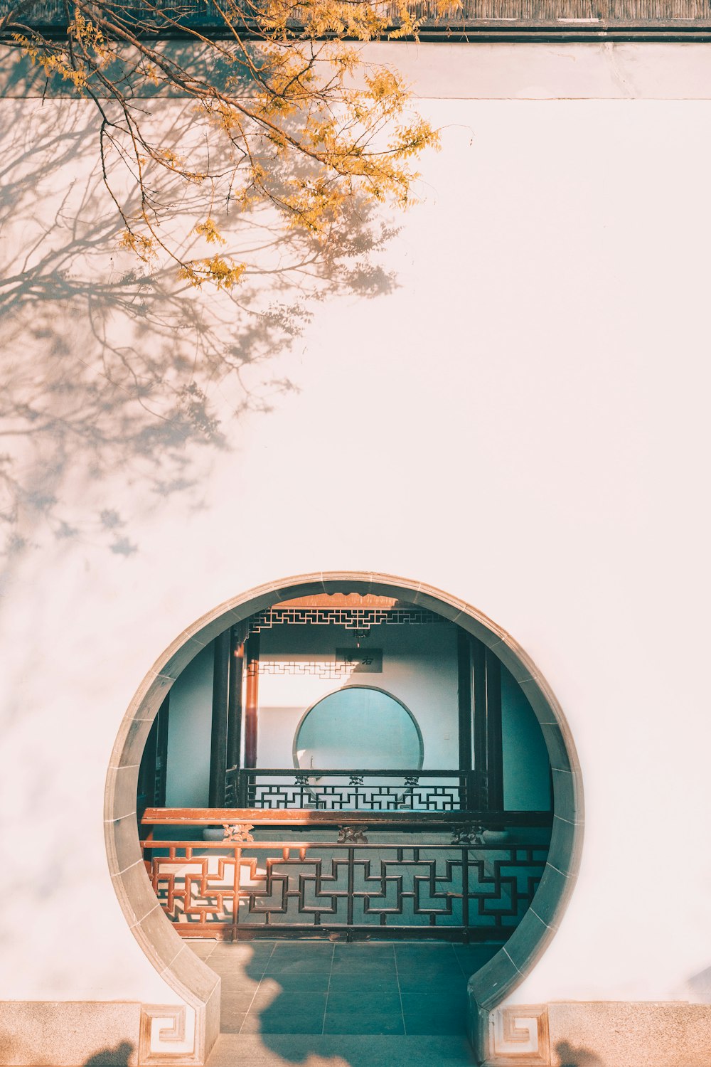 a circular mirror on the side of a building