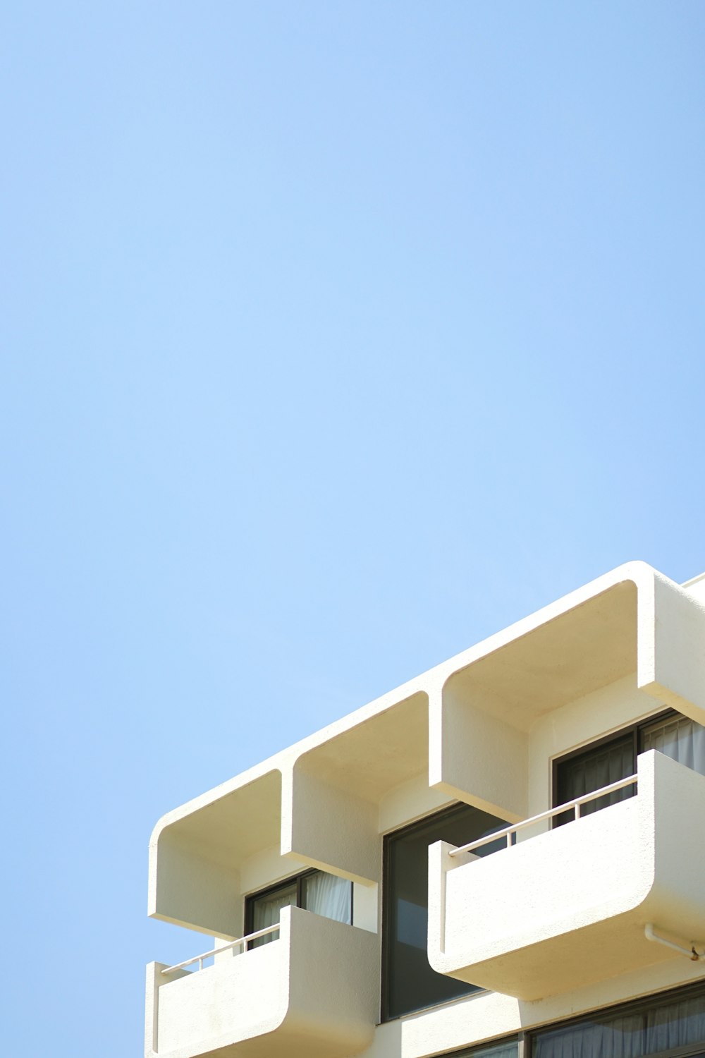 white concrete building under blue sky during daytime