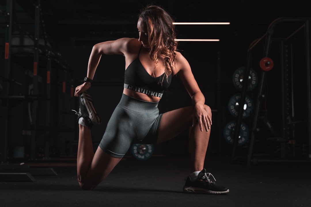 woman in black sports bra and gray shorts