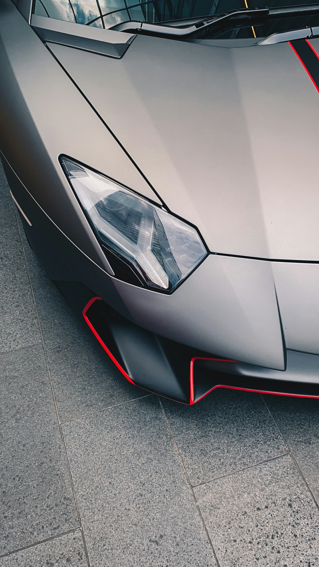 silver car on gray concrete floor