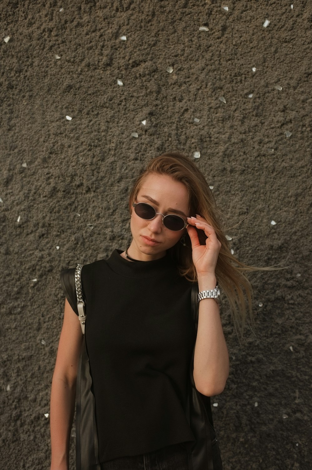 woman in black tank top wearing brown sunglasses