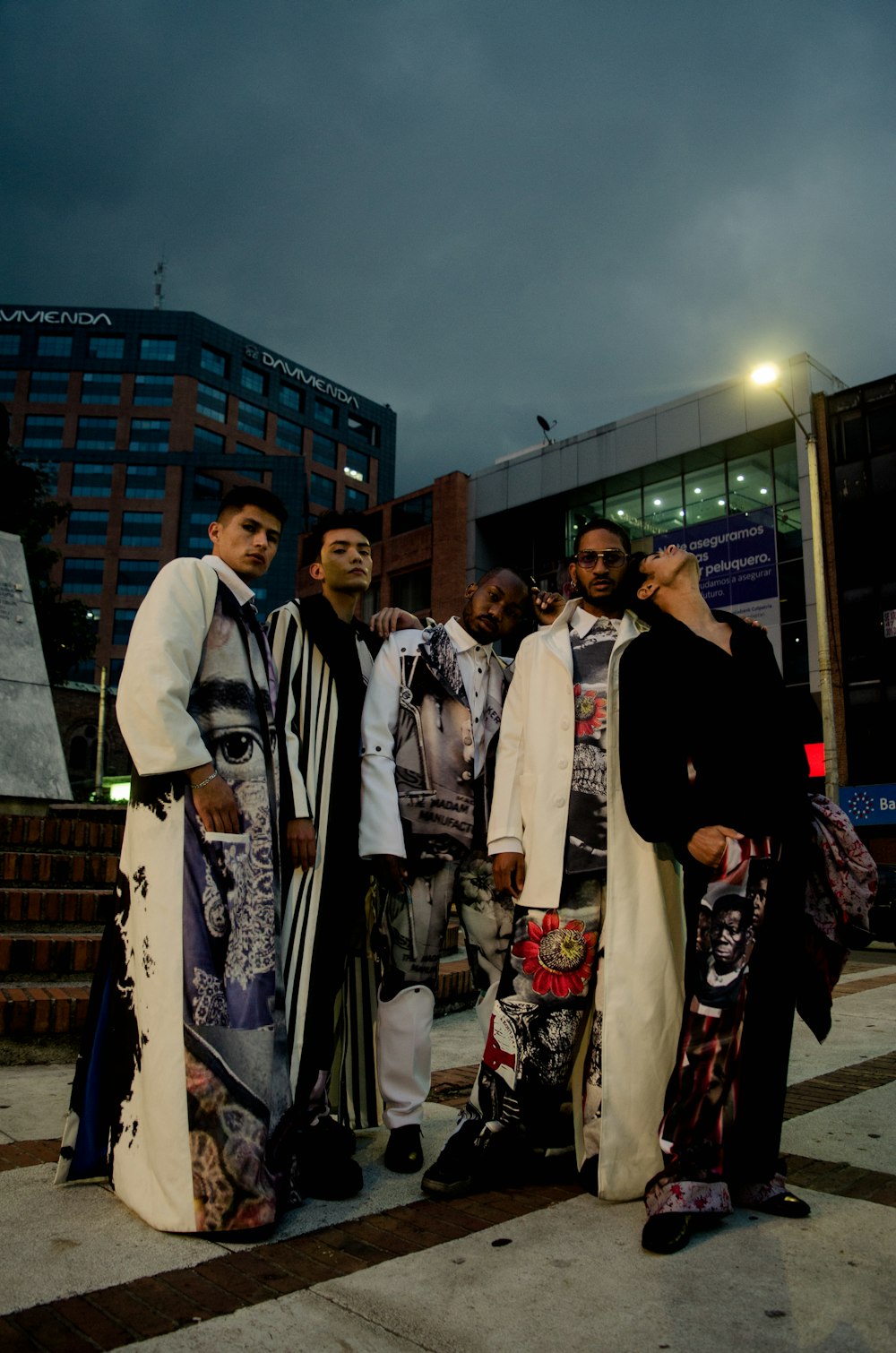 group of people standing on street during night time