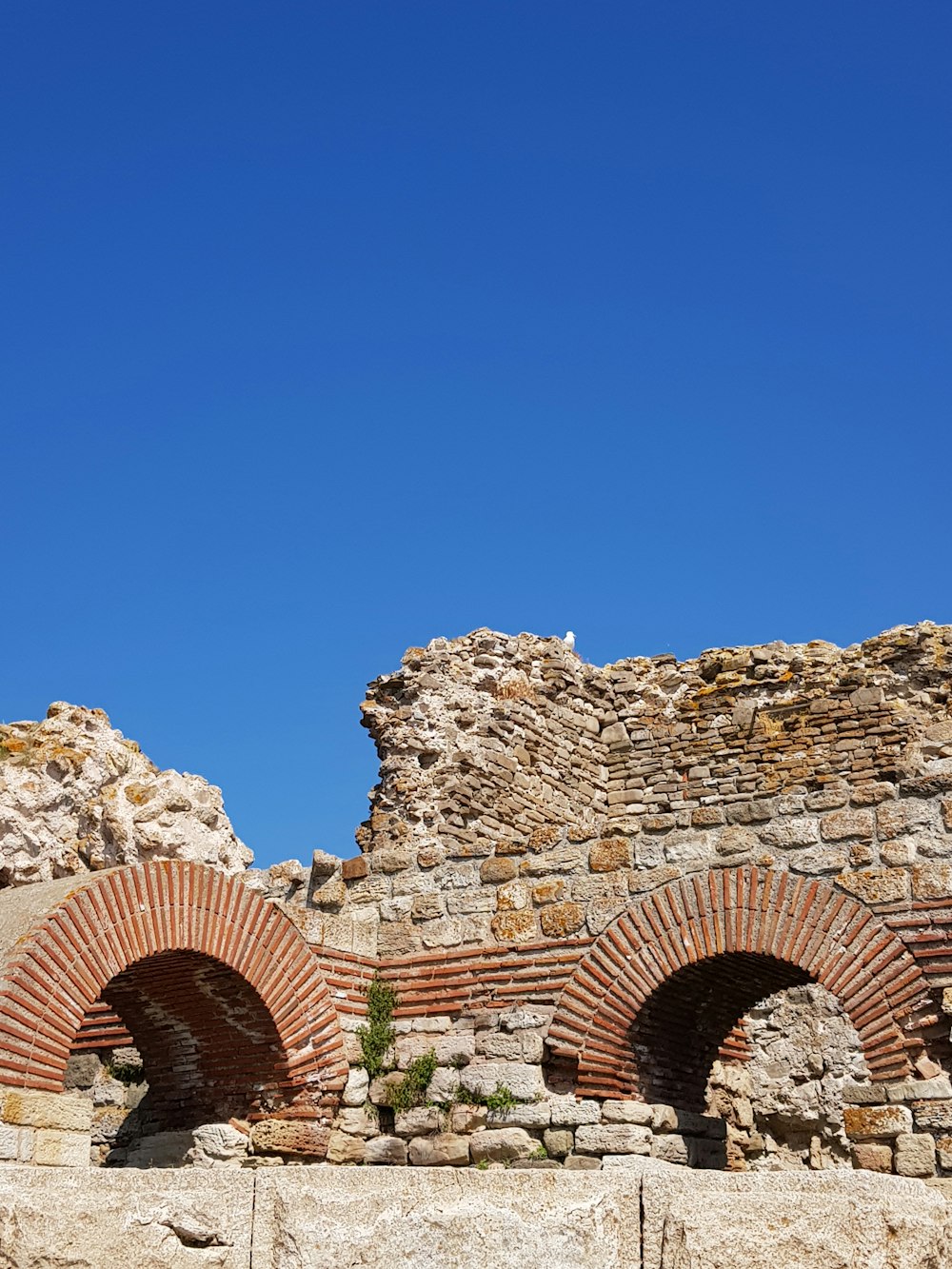 brown rock formation under blue sky during daytime