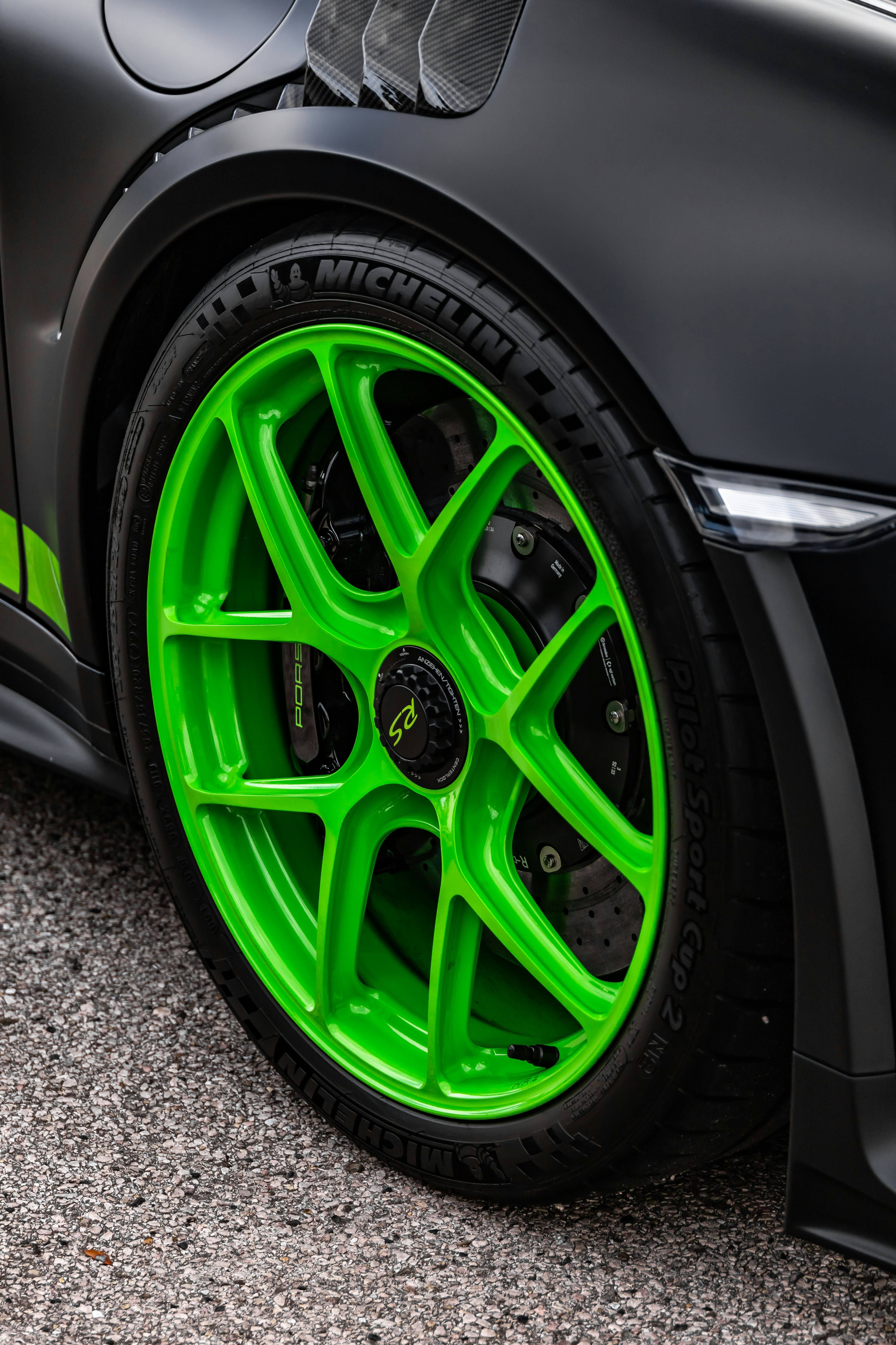 green and black car wheel