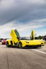 yellow ferrari 458 italia on road during daytime