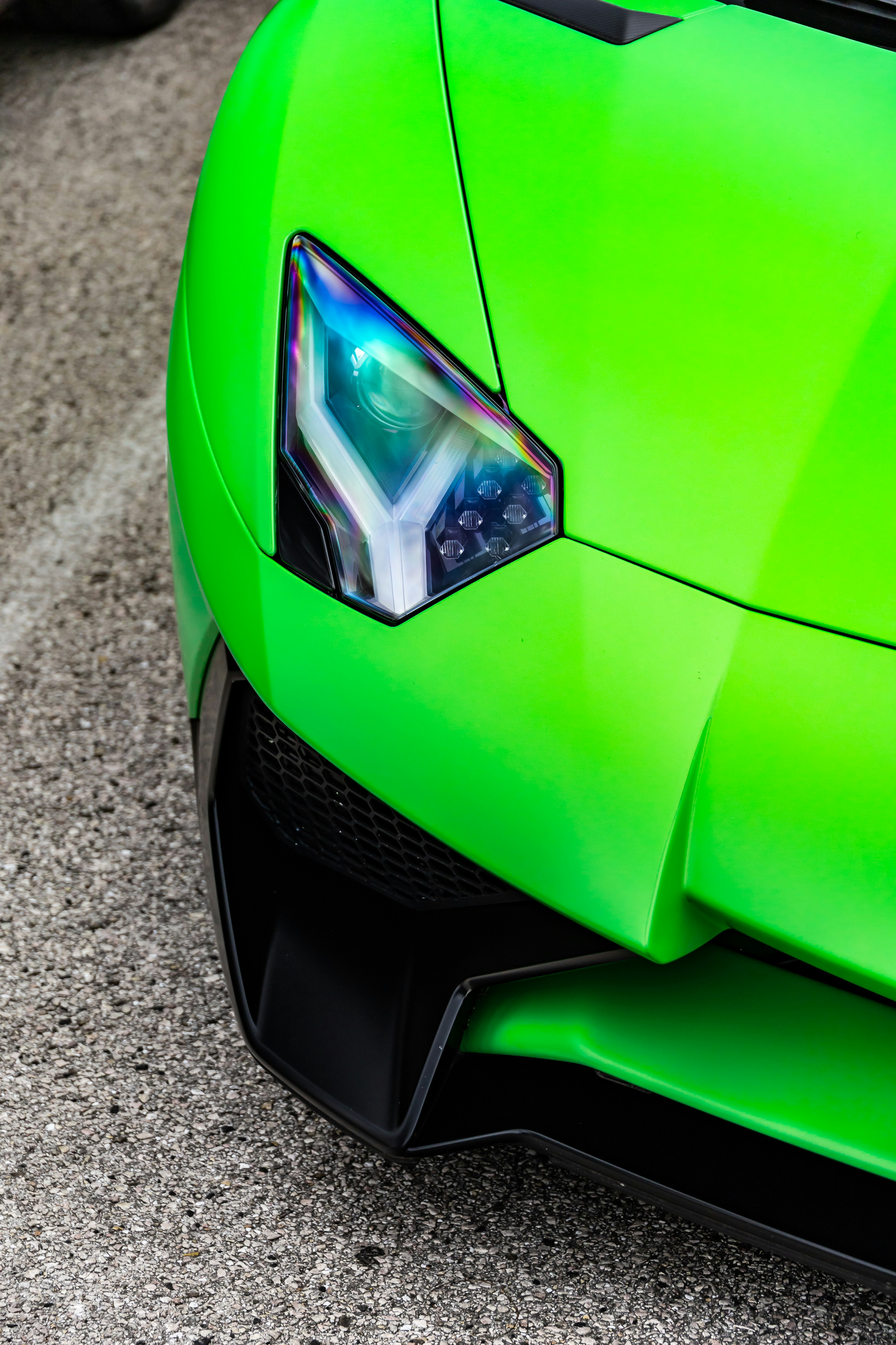 green car with black and white car