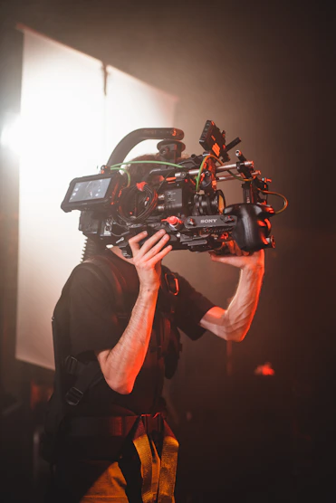 a man holding a camera up to his face