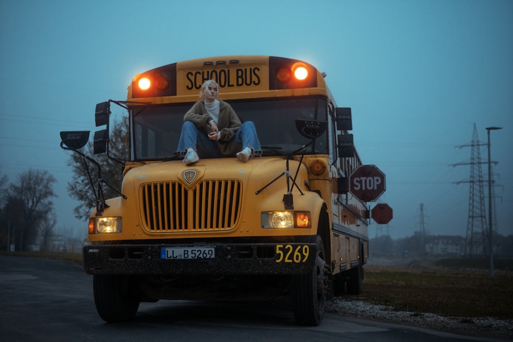 yellow school bus on road during daytime