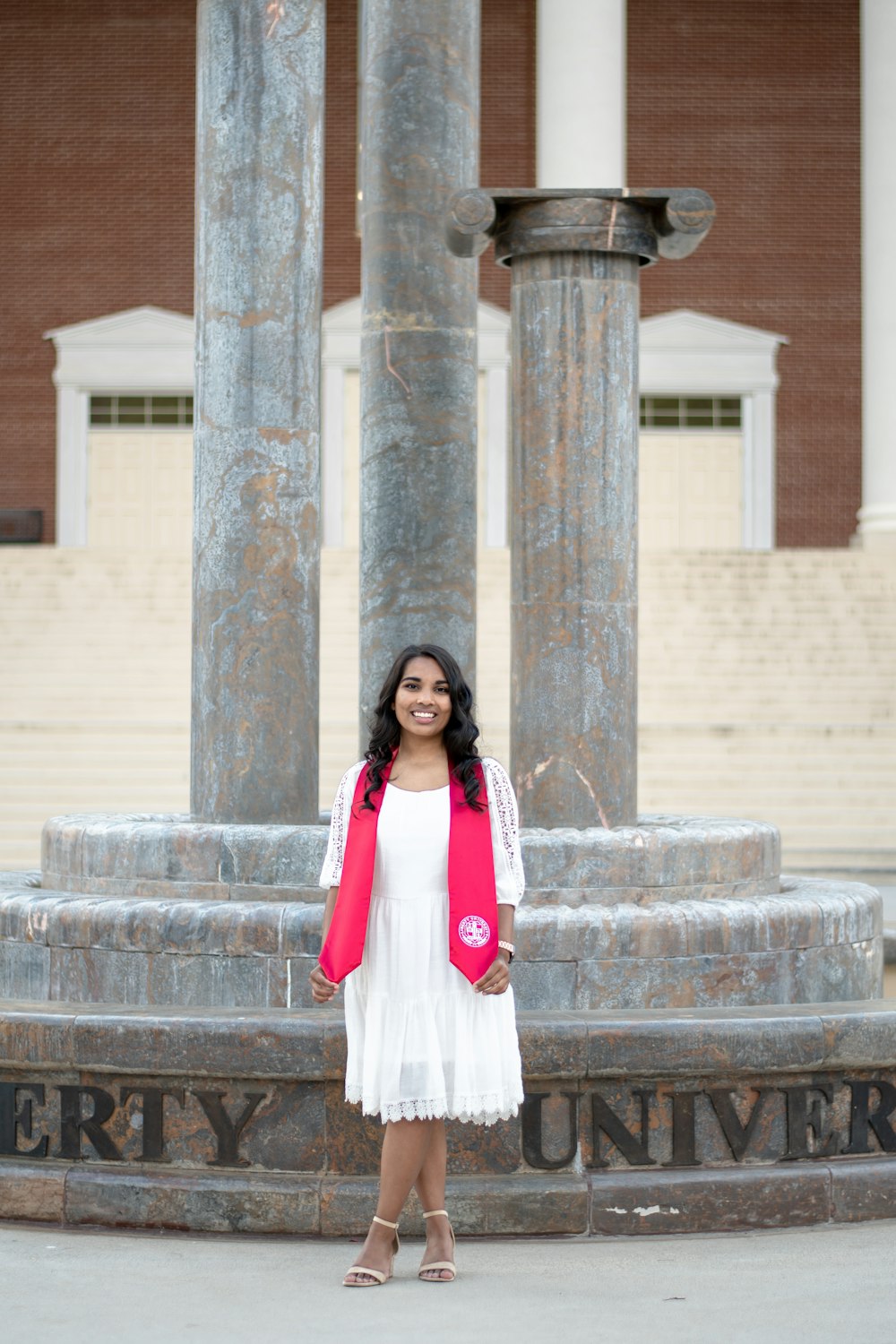 a woman standing in front of a building