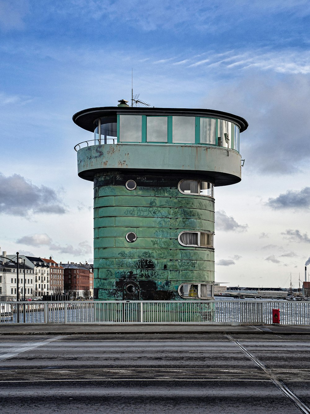 green and white concrete building under blue sky during daytime