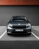 Front view of a sleek, modern fleet vehicle parked in a clean lot.