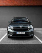 A sleek car parked safely, representing comprehensive vehicle insurance