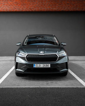 A sleek car parked safely, representing auto insurance coverage.