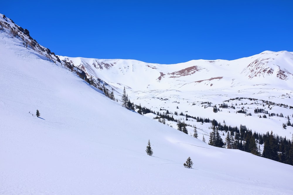 snow covered mountain under blue sky during daytime