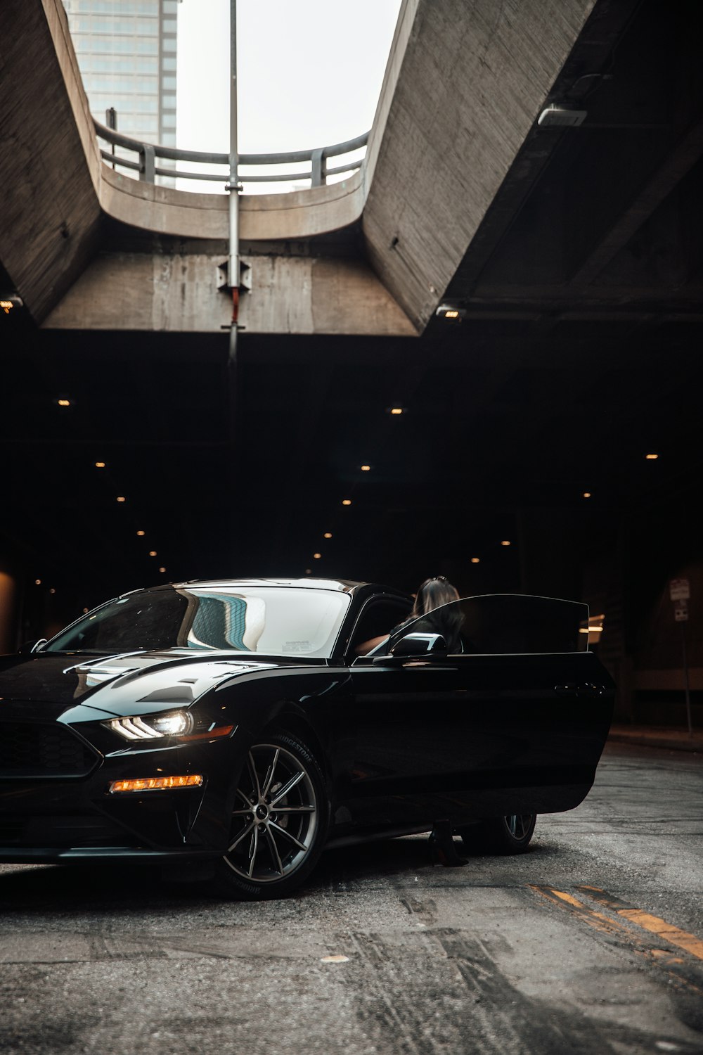 black porsche 911 parked in garage