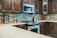 Close-up of a modern kitchen with polished countertops and custom cabinetry.