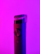 purple and black device on purple surface