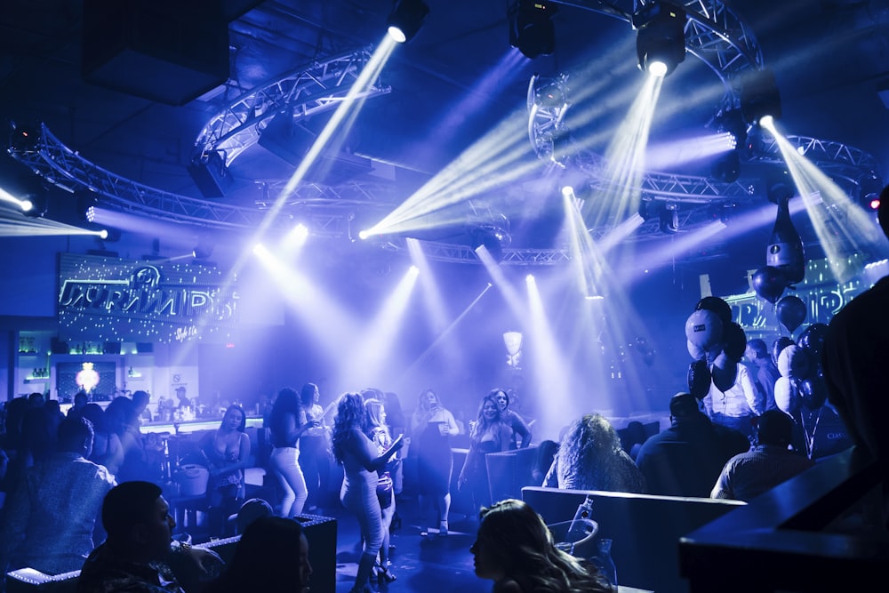 people standing on stage during night time