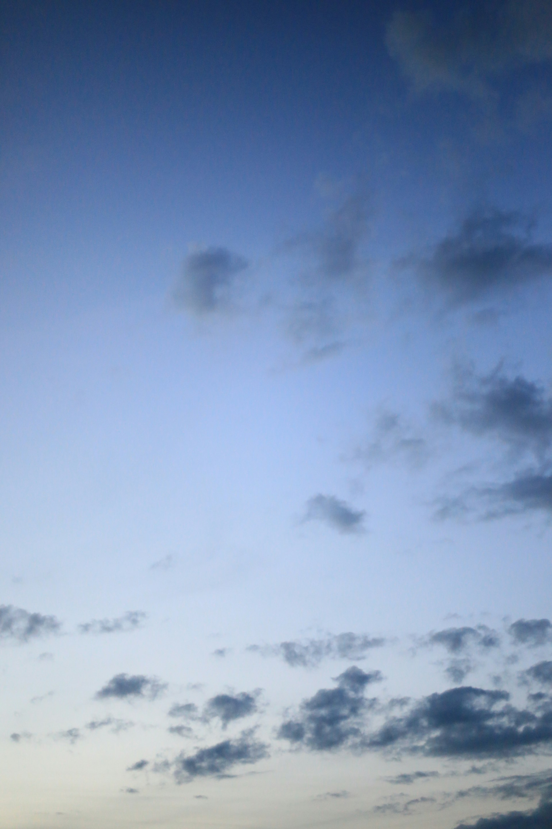 woman wearing yellow long-sleeved dress under white clouds and blue sky during daytime