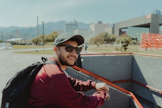 Man riding on a card with a backpack
