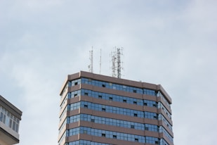 blue and white concrete building under white sky during daytime