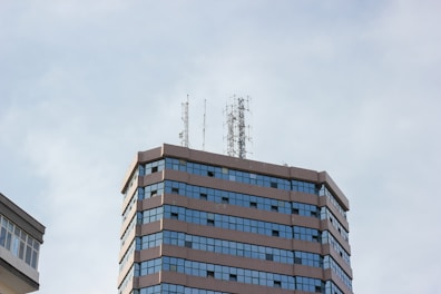 blue and white concrete building under white sky during daytime
