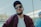 man in white crew neck shirt and purple jacket wearing black sunglasses