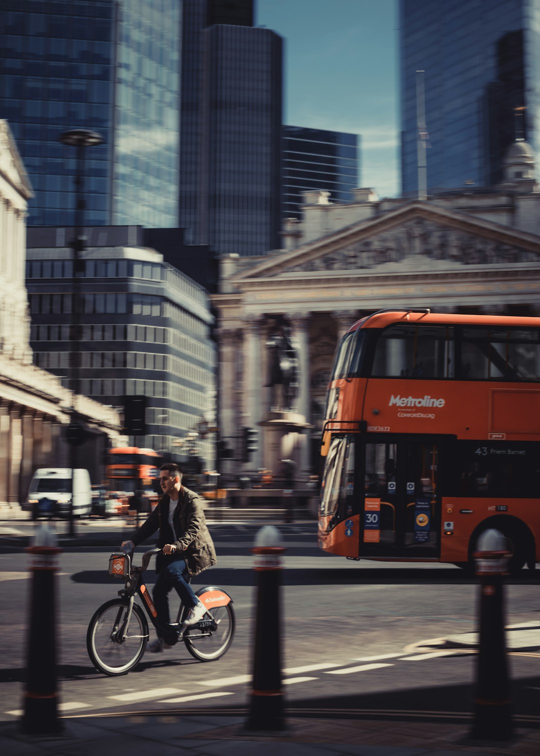 man in black jacket riding bicycle on road during daytime