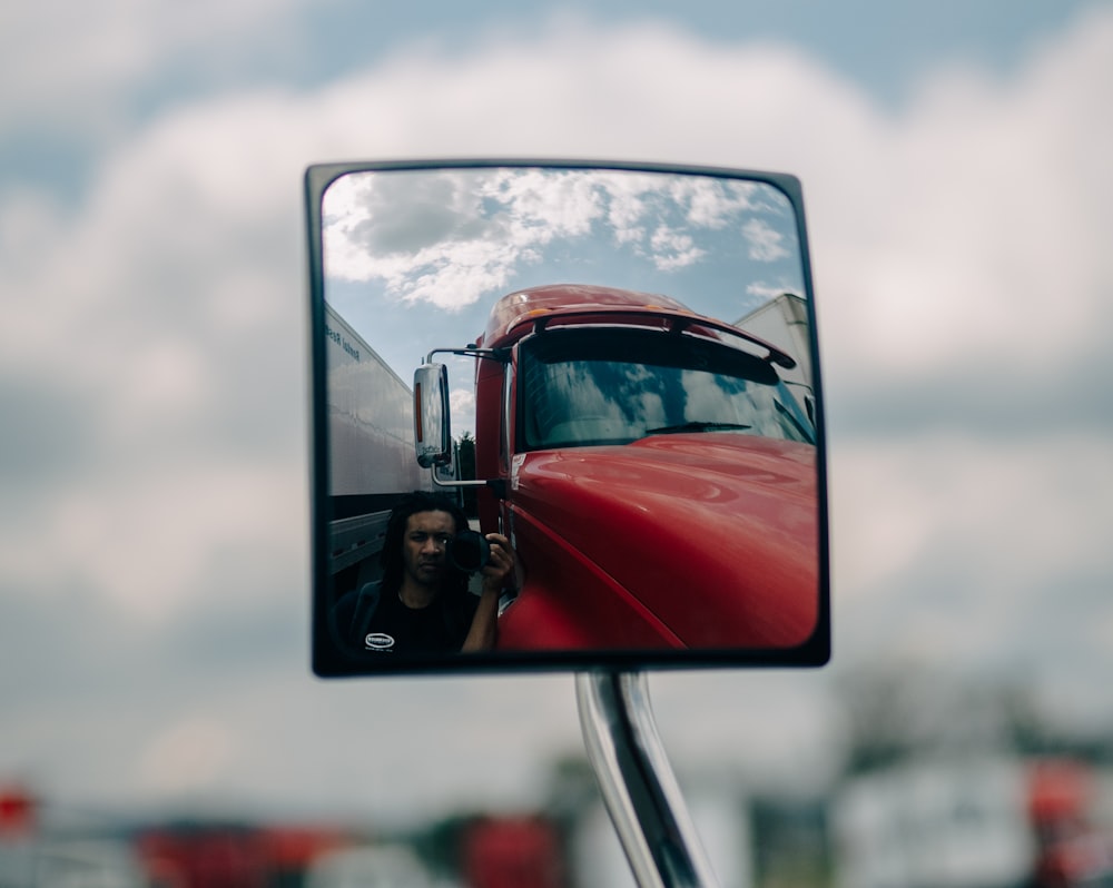 red car on road during daytime