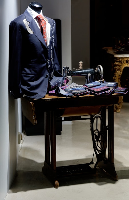 black suit jacket on black and brown sewing machine