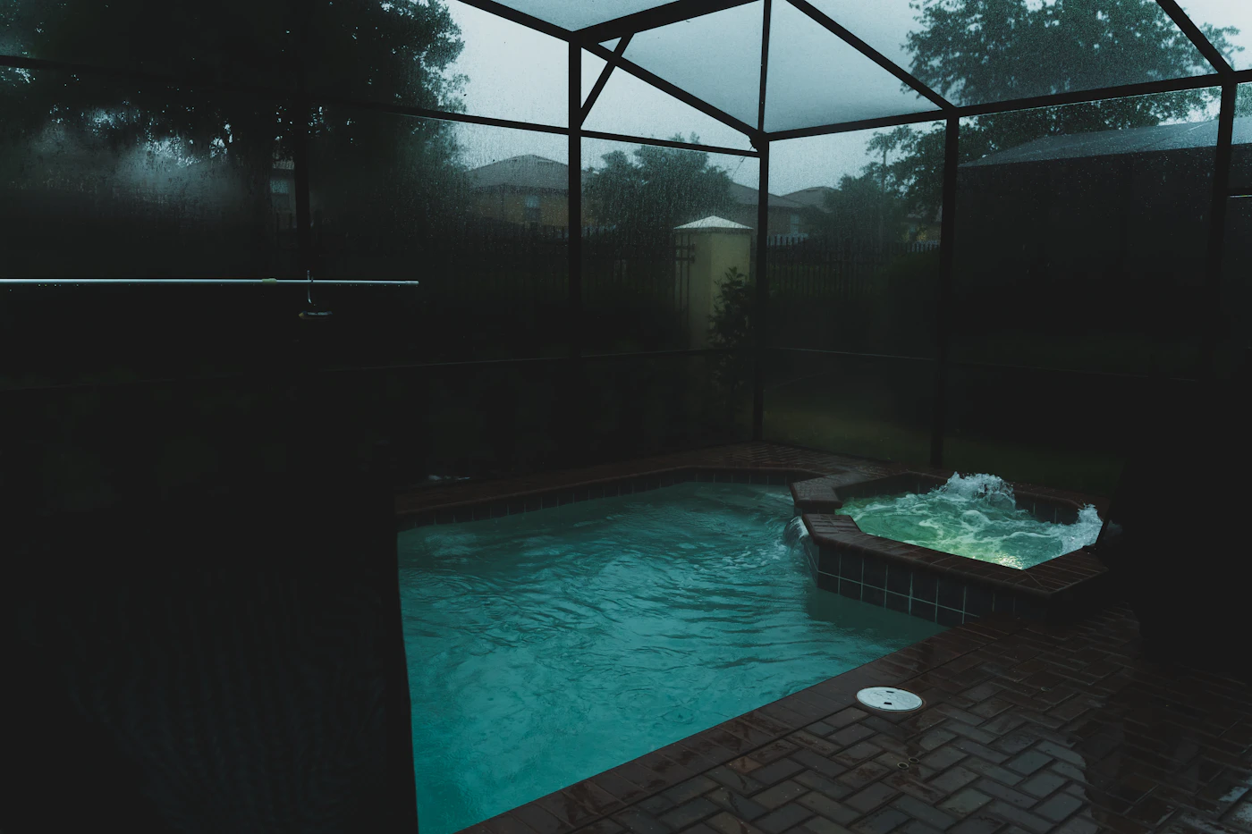 Clean swimming pool and deck in a Florida backyard