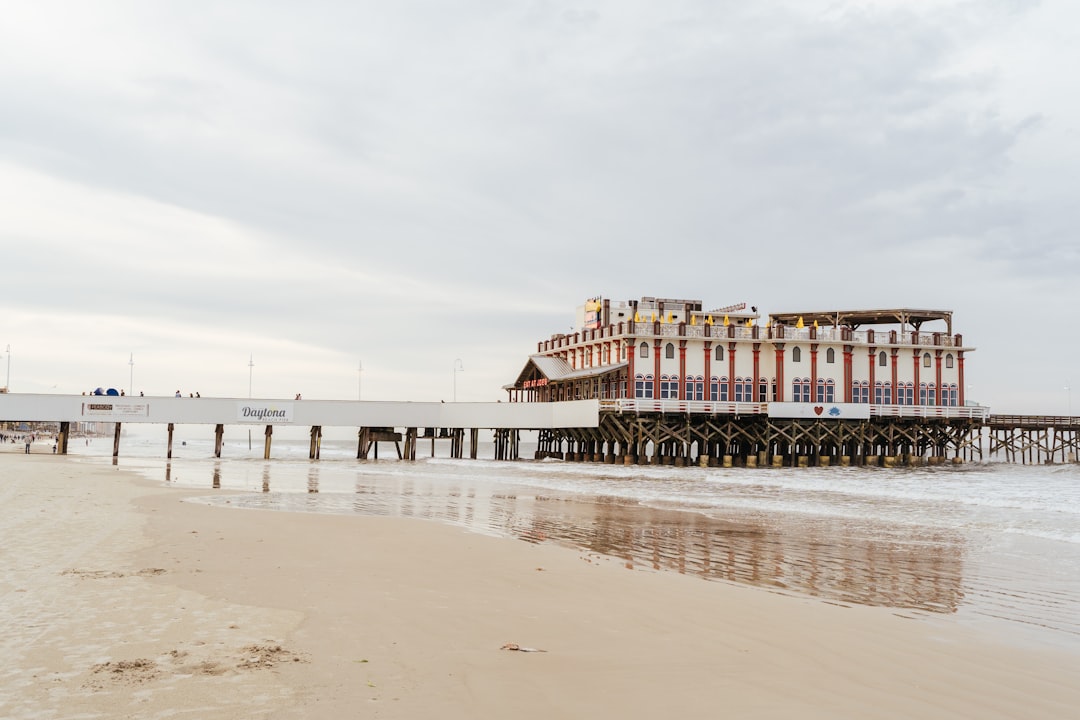 red and white building on beach during daytime