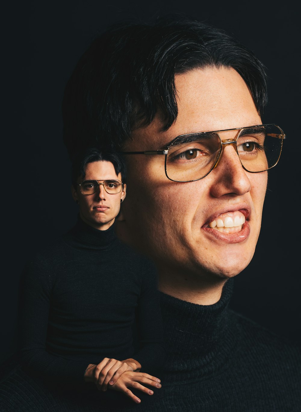 man in black crew neck shirt wearing black framed eyeglasses