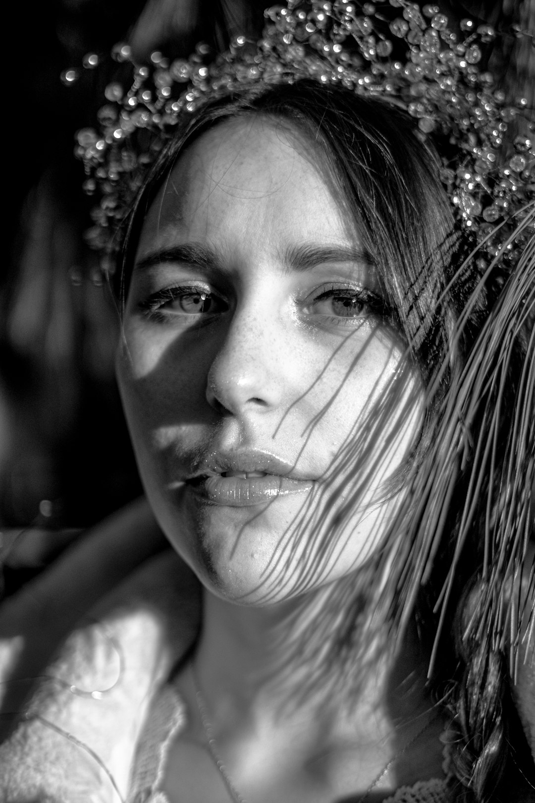 grayscale photo of woman wearing crown