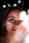 Close-up of a smiling woman with glowing skin holding a jar of moisturizer.