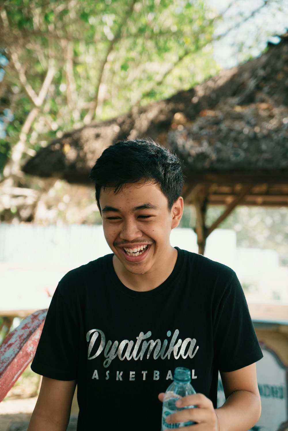 man in black crew neck t-shirt smiling