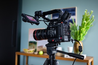 black dslr camera on tripod
