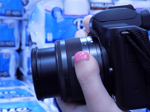 A close-up of a photographer capturing a product shot.