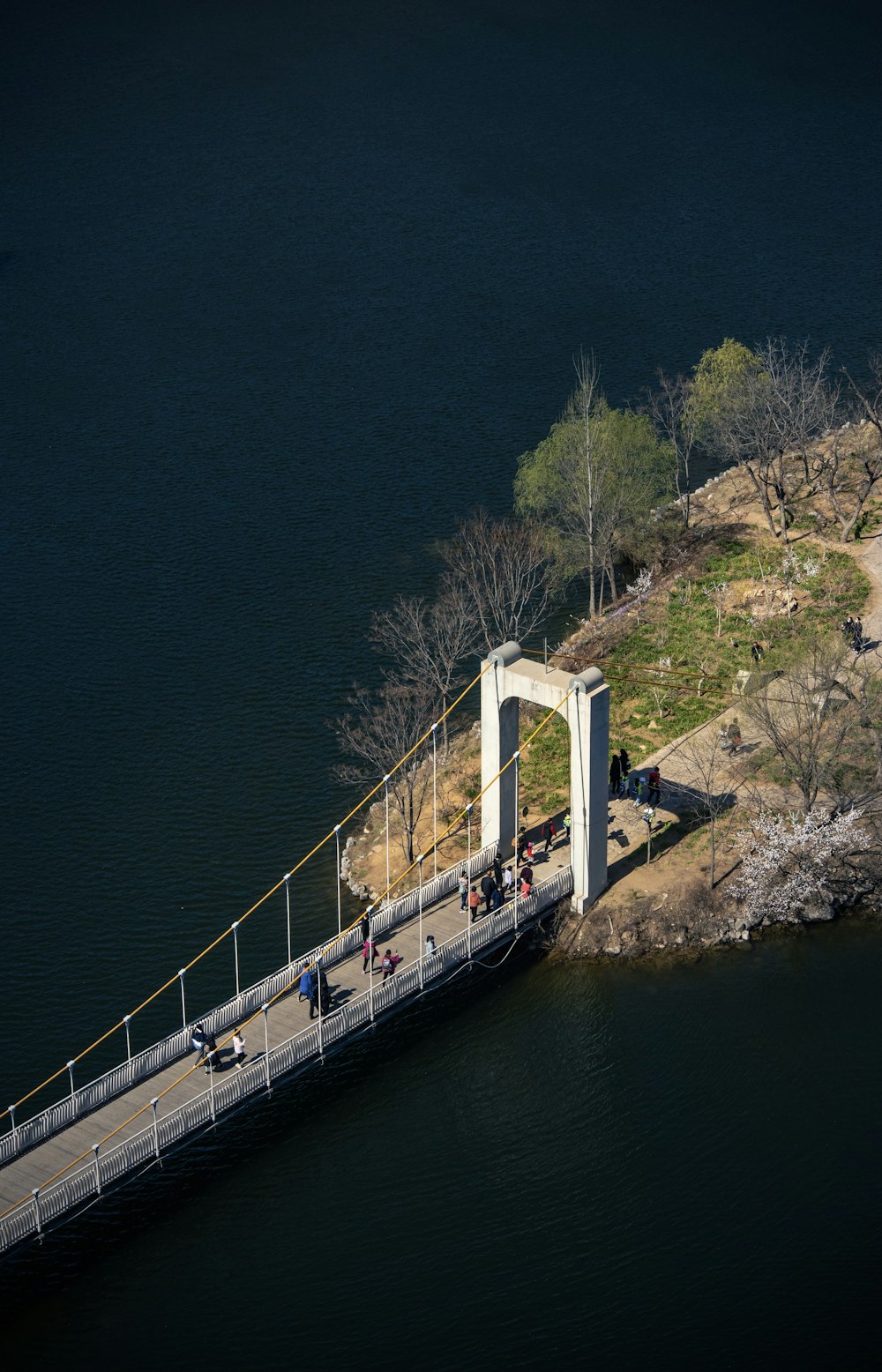 white bridge over body of water during daytime