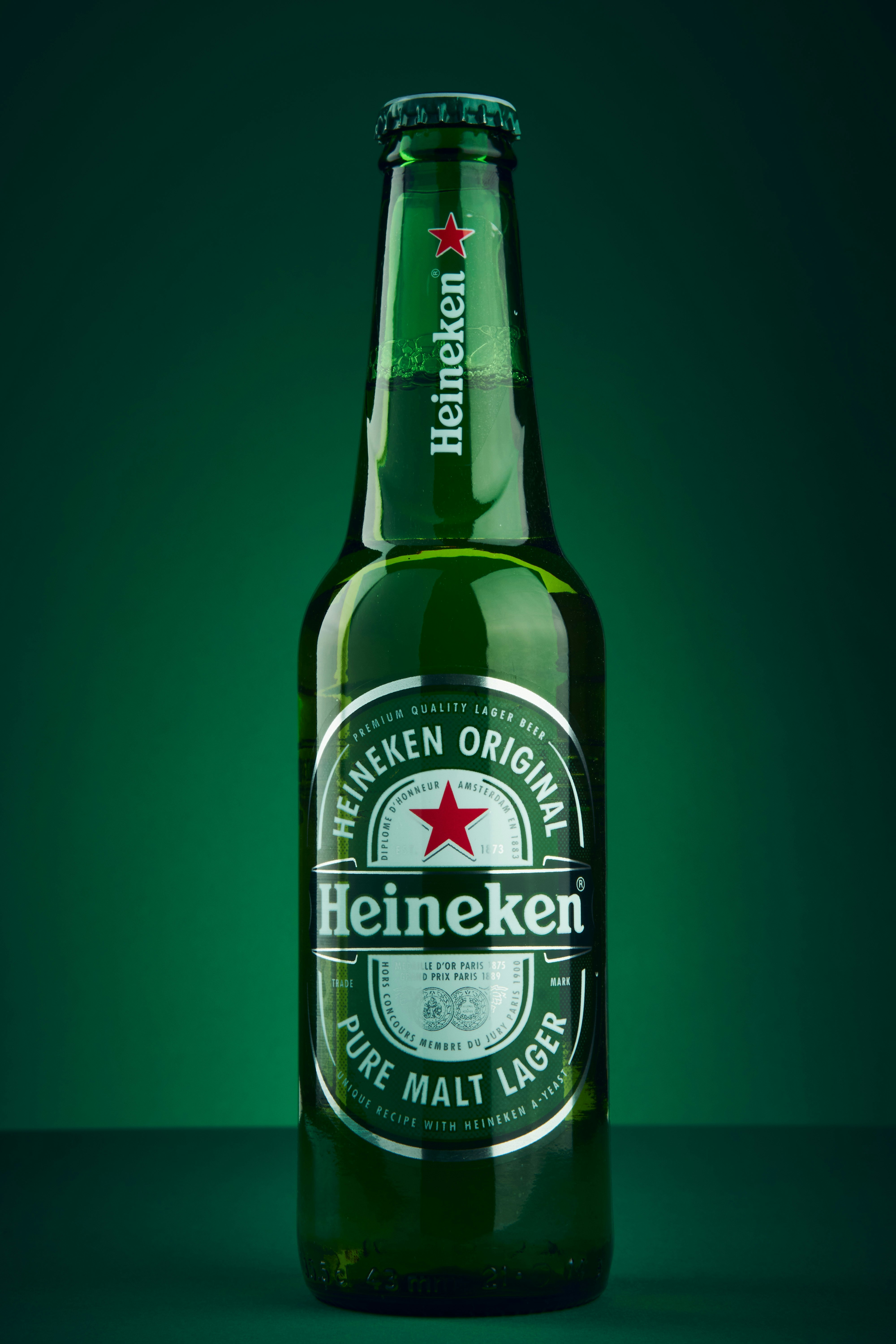 Photograph of a Heineken Original Pure Malt Lager Beer with an Advertisement feel to it. 